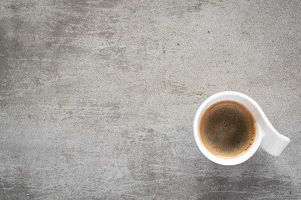 istock Cup of coffee on a gray concrete table 523861350