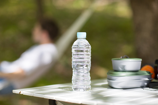 Bottled water on table at a camp site
