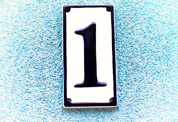 istock Ceramic Address Plaque Number 1 On Pale Blue Wall 523861598