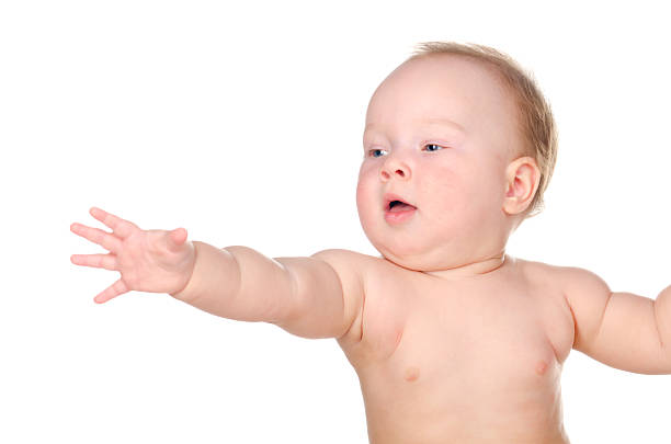 children, people, infancy and age concept. beautiful happy baby on light background at home