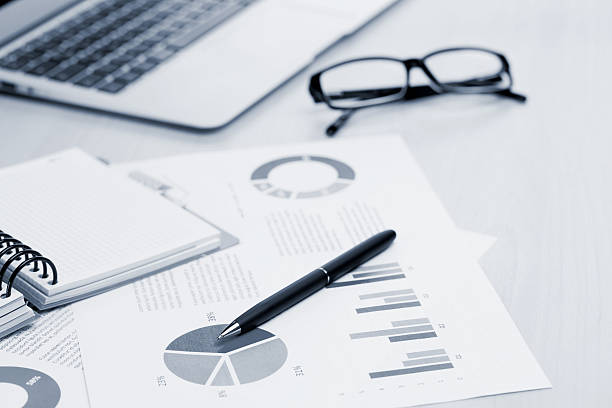 istock Office workplace with laptop, reports and pencils 523864182