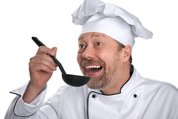 istock White male Cook in the kitchen with a ladle 523864186