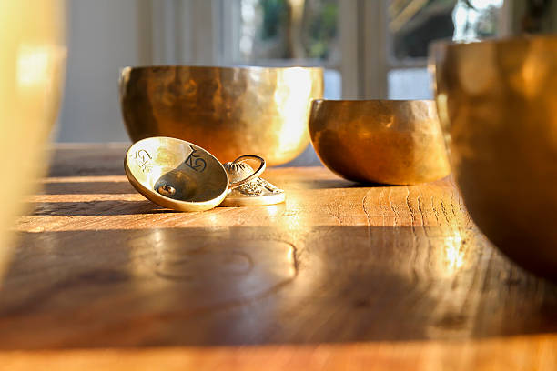 istock Tibetan bells on a wooden table 523864214