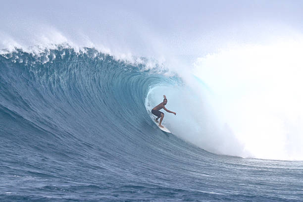 istock Surfer in a big windy barrel 523864308