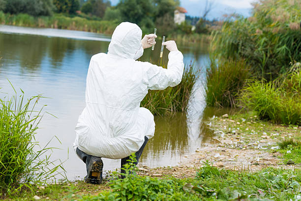 Scientist examing toxic water stock photo