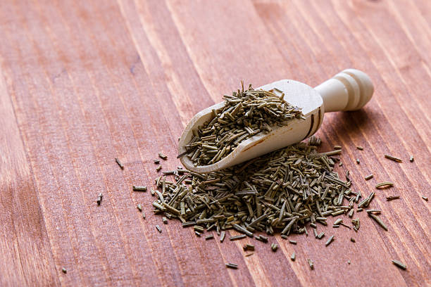 istock rosemary leaves on wooden table 523864480