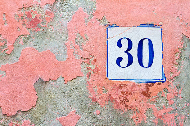 istock Ceramic Address Plaque Number 30 On Old Pink Wall 523865602
