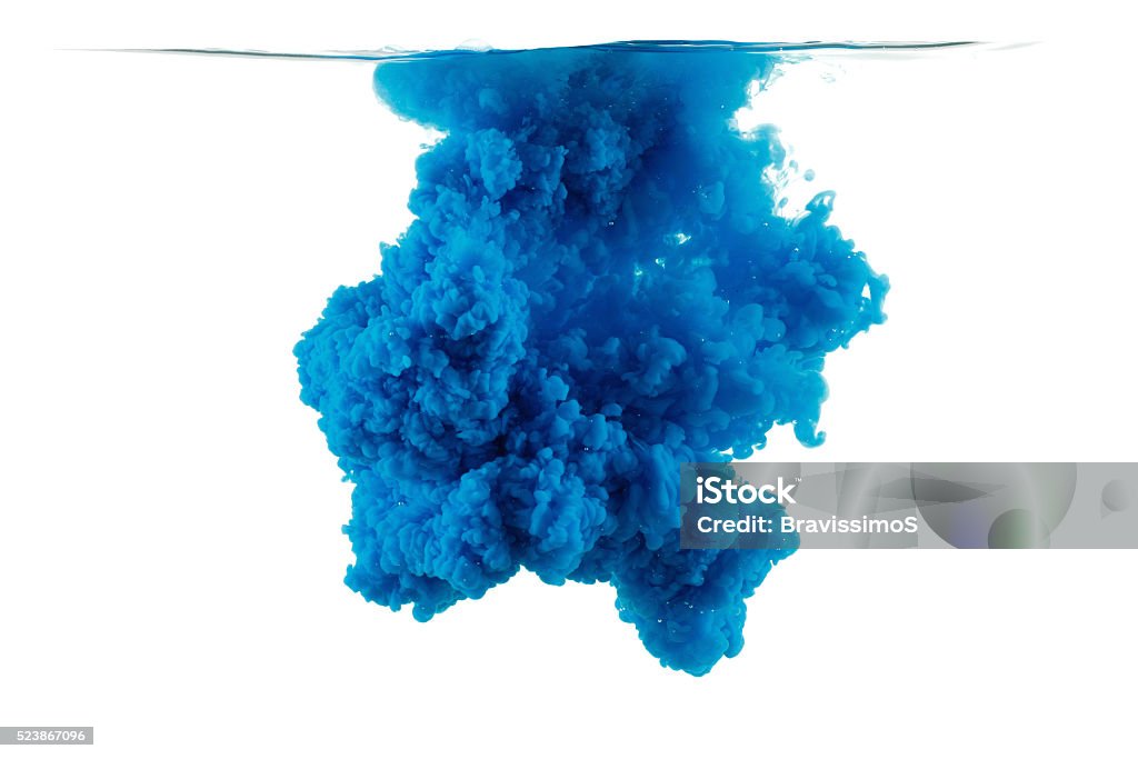 Color drop in water, photographed motion. Color drop in water, photographed in motion. Ink swirling in water. Cloud of ink in water isolated on white background. Colorful ink in water, ink drop. Coloring Stock Photo