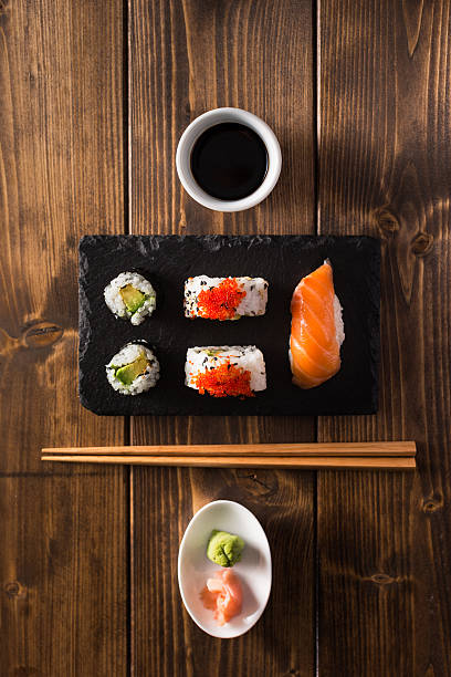 istock Maki sushi on a wooden table. Top view 523867790