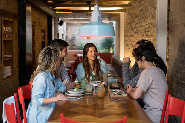 istock Friends eating together at a restaurant 523868038