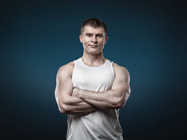 istock Young muscular man isolated on gray background 523868344