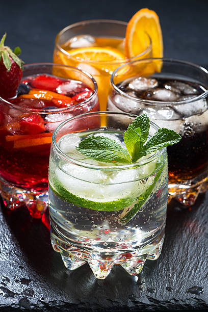 istock assortment of iced fruit drinks on a dark background, vertical 523869146