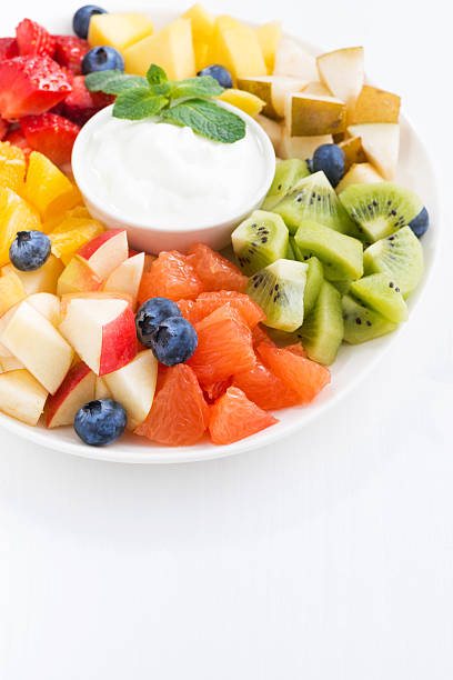 istock fresh ingredients for fruit salad and natural yoghurt on plate 523870476