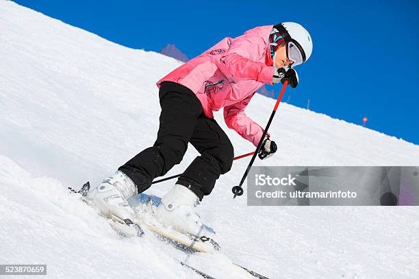 Teenage Girl Snow Skier Skiing On Sunny Ski Resorts Stock Photo - Download Image Now