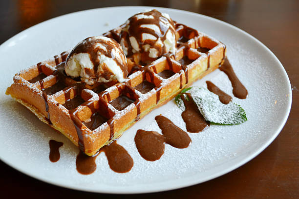istock Belgian waffle with ice cream, chocolate and mint 523870885