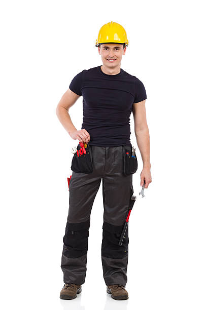 istock Relaxed manual worker posing with a wrench 523871897
