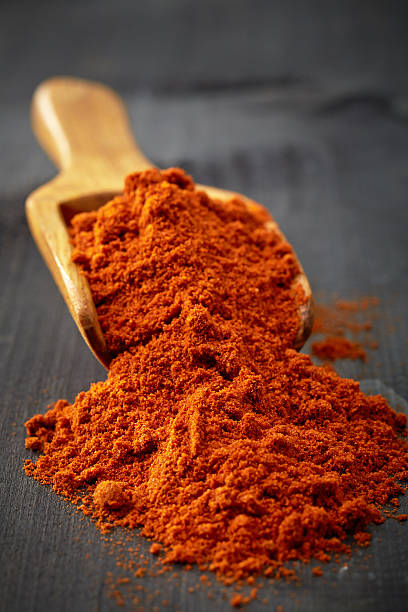 istock Wooden scoop with ground chili 523871899