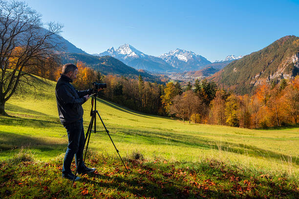 istock Photographer take picture from watzmann at autumn 523872447