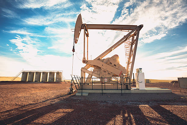 Fracking Oil Well Industrial Fracking Oil Well pumping natural resourcesFracking Oil Well is conducting a fracking procedure to release trapped crude oil and natural gas to be refined and used as energy north dakota stock pictures, royalty-free photos & images