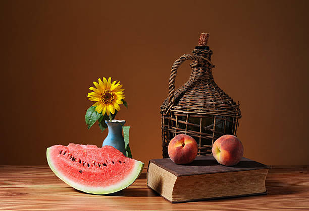 Cutted watermelon, sunflower blossom and peach