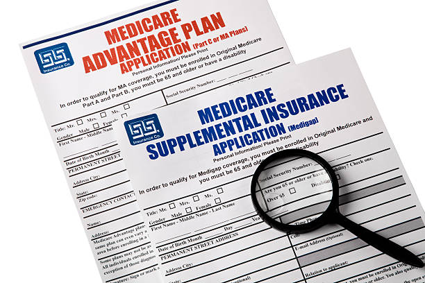 istock Medicare Applications, magnifying glass on top, Isolated on white 523873521