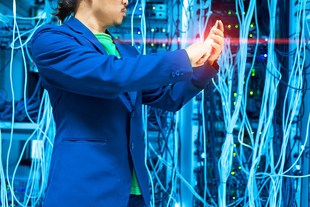 istock People Use smart phone in datacenter room 523873522