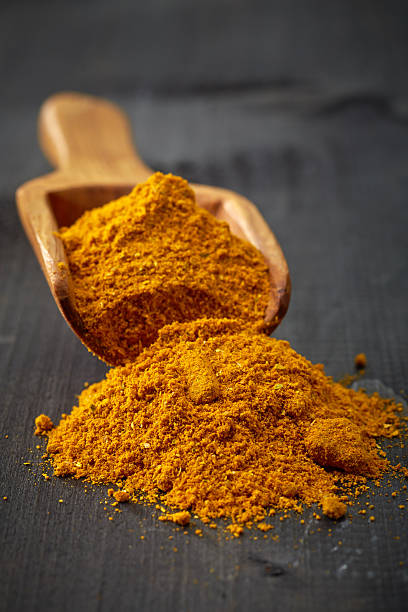 istock Wooden scoop with curry 523873609