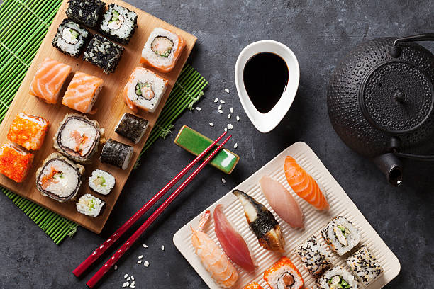 istock Set of sushi and maki roll and green tea 523873780