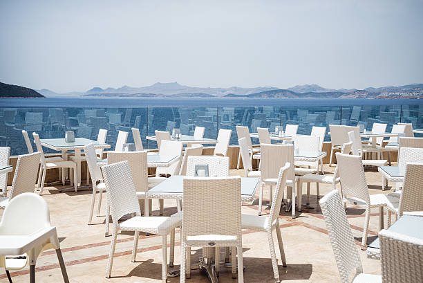 Sea View Restaurant Sea View Restaurant with white chairs and tables baros photos stock pictures, royalty-free photos & images
