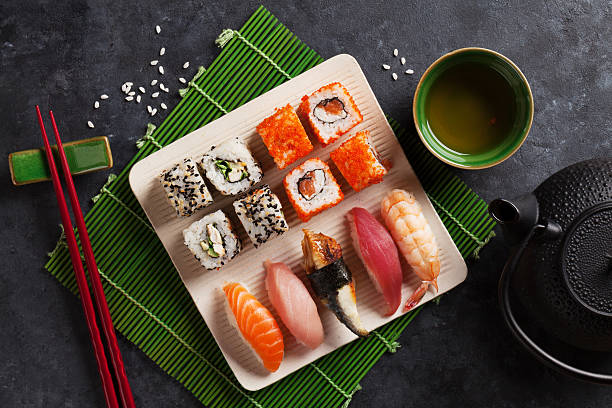 istock Set of sushi, maki and green tea 523873968