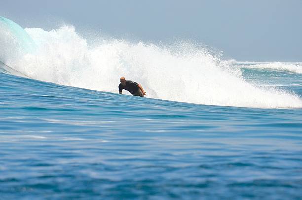 istock Surfing the Maldives 523874273