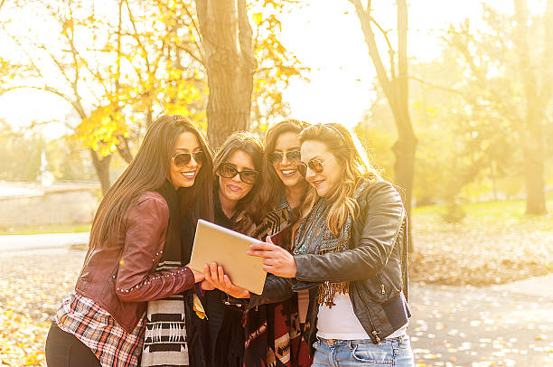 istock Group of young women using digital tablet 523874277
