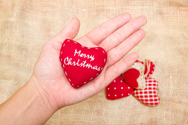 istock Christmas heart in hand 523876077