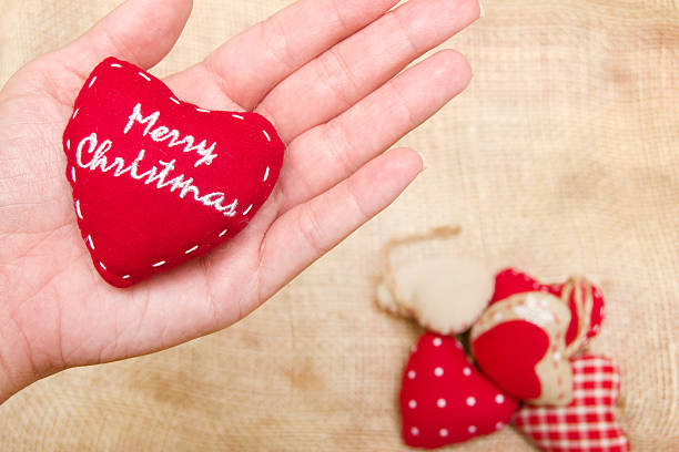istock Christmas heart in hand 523876081