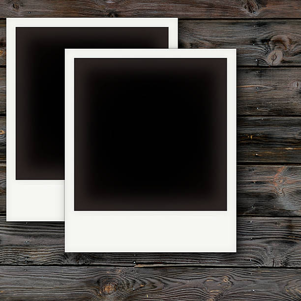 istock Vintage photo frames on wooden board 523876243