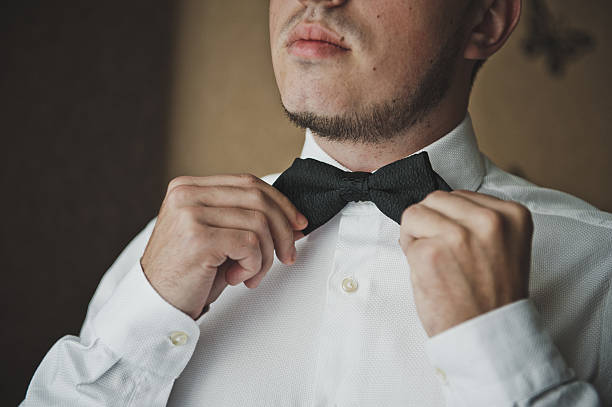 istock The man straightens his tie 523876294