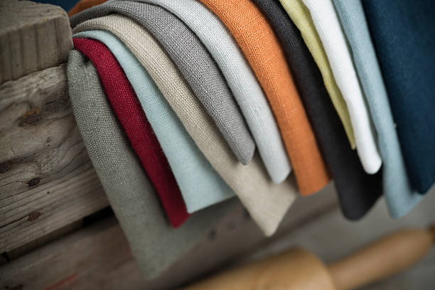 Layers of Folded Cotton Fabric Hanging on Crate