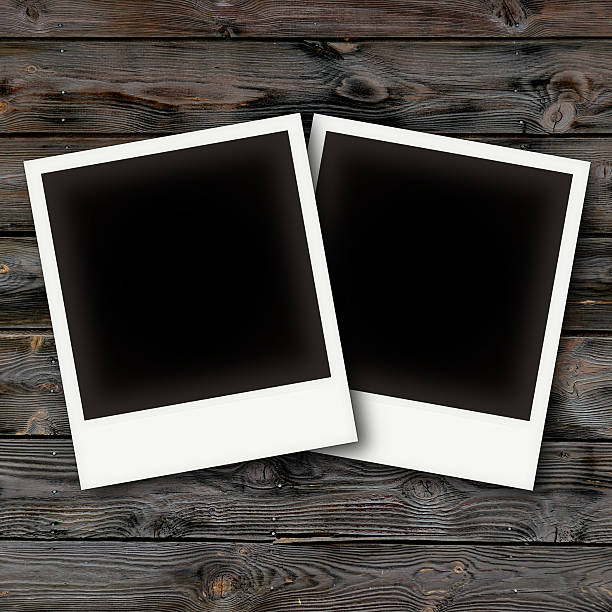 istock Vintage photo frames on wooden board 523877261