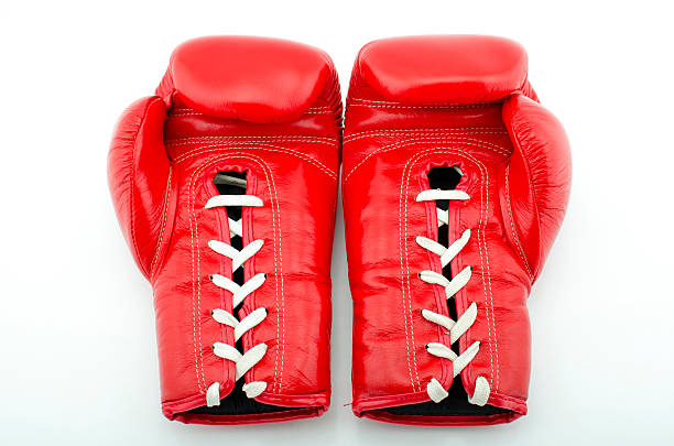 3D Rendering of two shiny red boxing gloves. 3D Rendering isolated on white.
