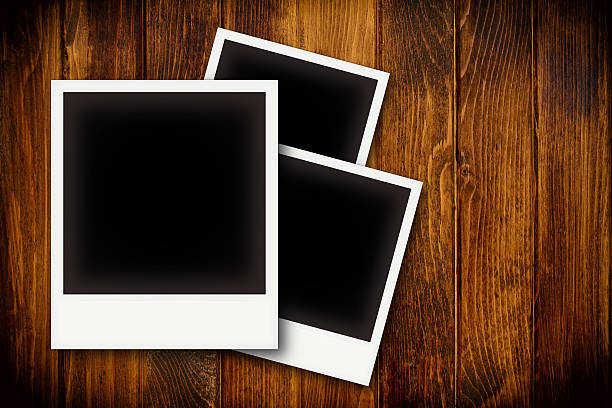 istock Photo frames on wooden board background texture 523877557