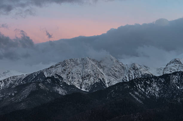 istock Tatra mountains, Giewont peak on winter evening 523878940