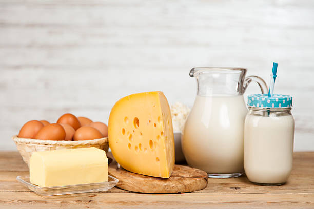 istock Milk jar on wooden table 523880466