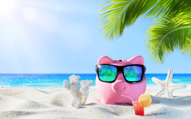 istock Piggy Bank With Drink On The Palm Beach 523880792