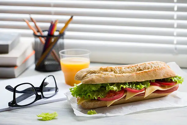 Photo of Sandwich from fresh baguette on work place