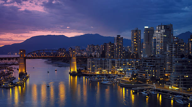 Vancouver - Canada Yaletown and the Burrard Bridge in False Creek in the city of Vancouver, British Columbia in Canada. vancouver at night stock pictures, royalty-free photos & images