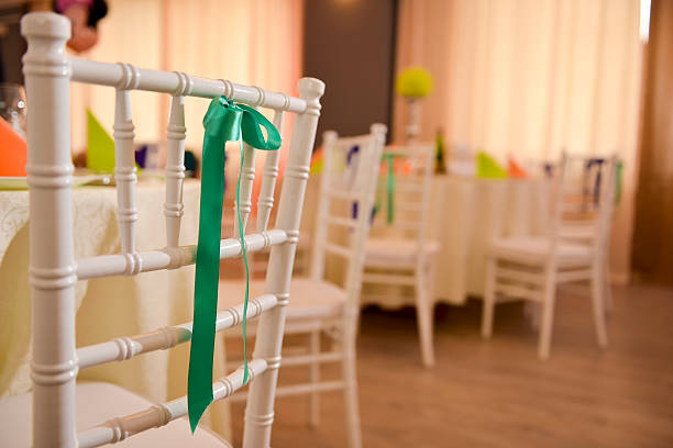 istock White wooden chair with a green bow 523883716