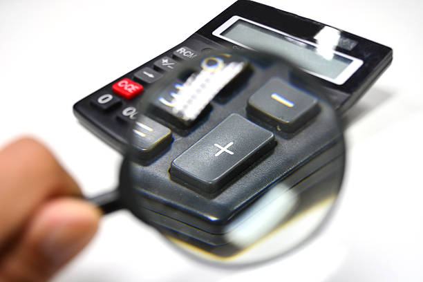 Magnifier and calculator stock photo
