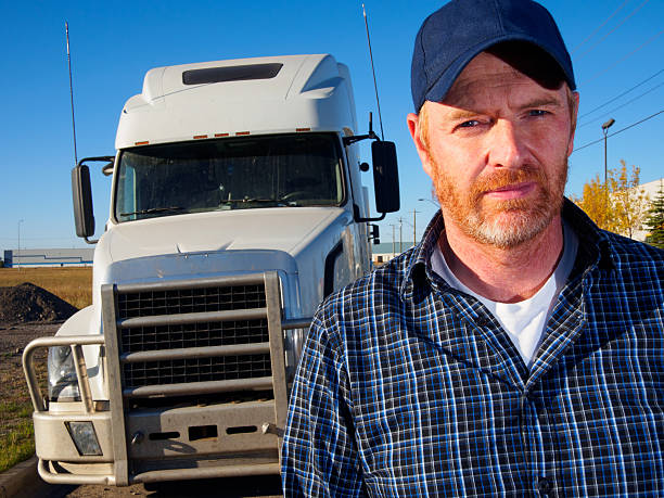 istock Truck Driver and White Truck 523893921