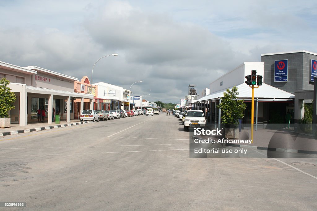 Main Road in Tsumeb, Oshikoto Region, Namibia, Africa Tsumeb, Namibia - January 28, 2006: Some shops and restaurants are located at the main road in Tsumeb city and it is easy to reach the location by car. Cars park at the roadside. 4x4 Stock Photo