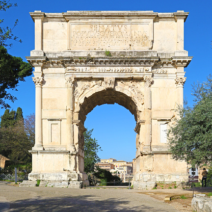Rome, Italy - February 21, 2014: Front face of Arch of Titus in full sun.